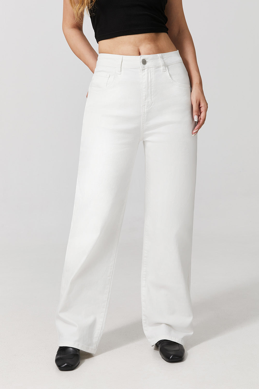 Women wearing white wide leg stretch jeans