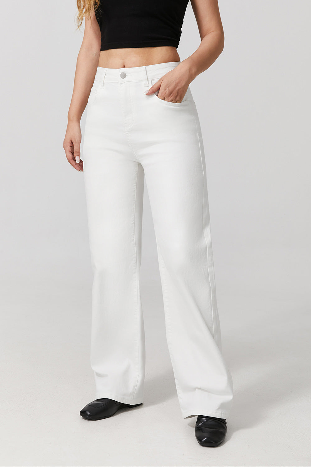 Women wearing white wide leg stretch jeans