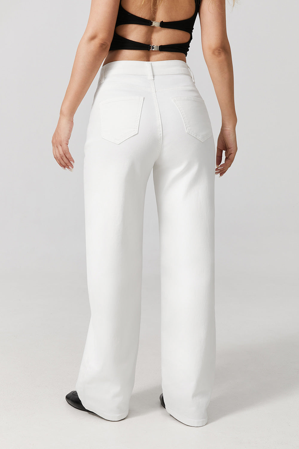 Women wearing white wide leg stretch jeans
